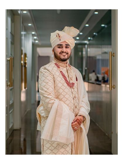 A classic and elegant portrait of the groom in his wedding attire, looking happy and ready for the big moment.