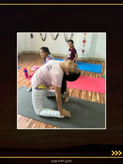 A group of young girls practicing Ustrasana together, supporting each other's journey in flexibility and strength.