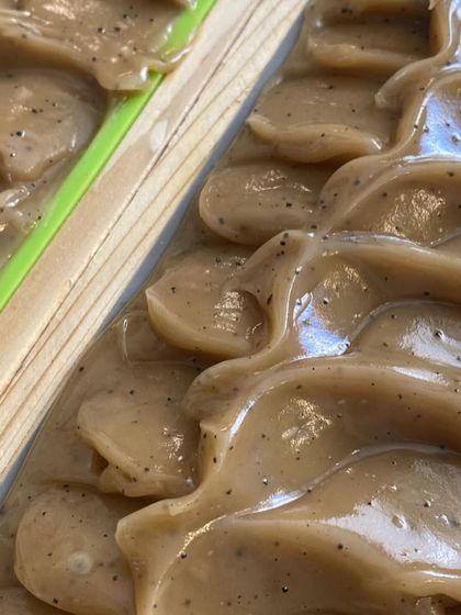 A freshly poured soap top with a beautiful texture. This is our coffee exfoliating soap batter before it's fully set.