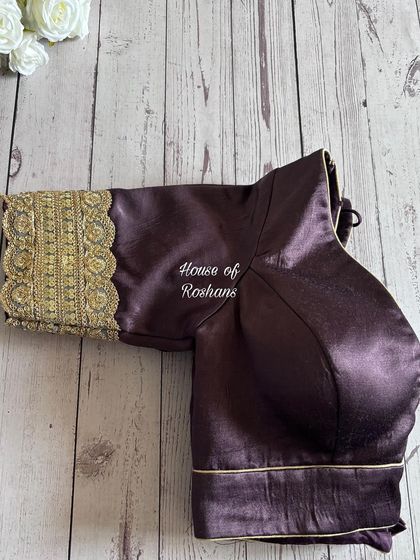A classic full-sleeved blouse in a rich, dark silk with heavily embroidered cuffs. This is an elegant and royal choice.