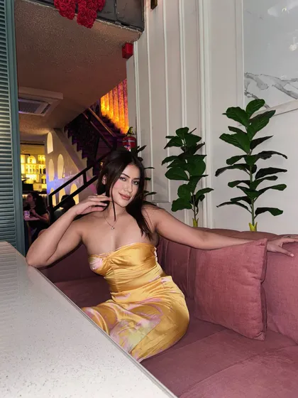 A happy, candid moment in the yellow satin party dress.
