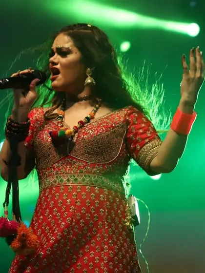 A powerful solo moment during a high-energy performance. Each of us has our own style, which comes together to create the unique Preety & Pinky experience.