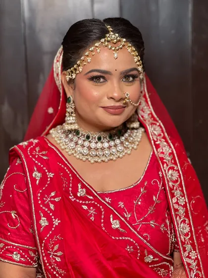 A smiling portrait of the bride, looking happy and confident.