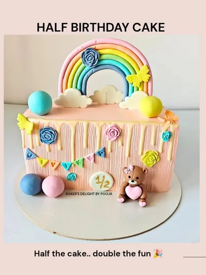 A colorful half-birthday cake with a rainbow, teddy bear, and bunting. A perfect example of a smaller cake for an intimate milestone celebration.