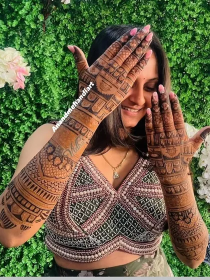 Another pose from a happy client, her smile as bright as her dark henna stain.