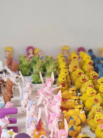 An assortment of our character miniatures, including yellow ducks, smiling frogs, and pink unicorns. These are perfect for adding a playful touch to your plant decor.