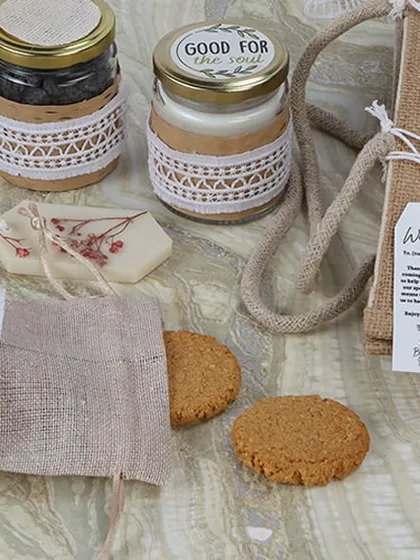 A close-up of an eco-friendly gift hamper featuring natural textures like jute and paper. This style of photography is ideal for brands wanting to emphasize their commitment to sustainability and organic quality.