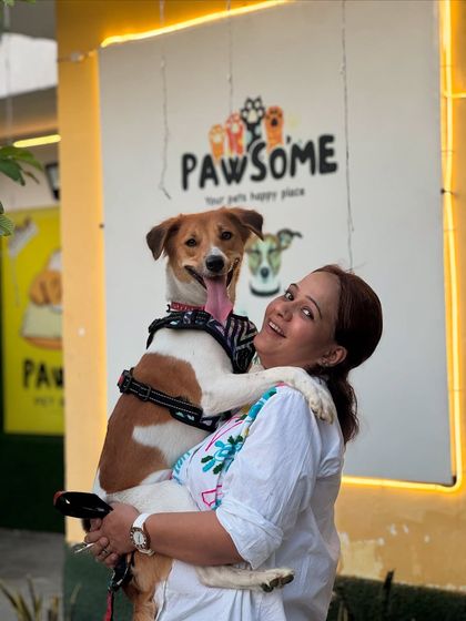 A beautiful photo of a happy owner and her dog. The love between them is so clear.