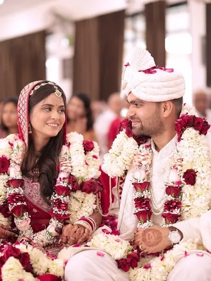 The happy couple, seated together after the wedding rituals are complete. Their smiles show that love, celebrated with tradition, is the most beautiful thing.