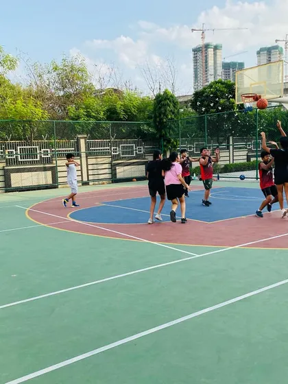 A female player goes up for a jump shot.
