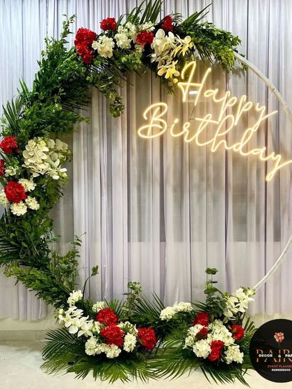 A unique birthday ring made with fresh greenery and flowers, offering a natural and beautiful alternative to balloons.