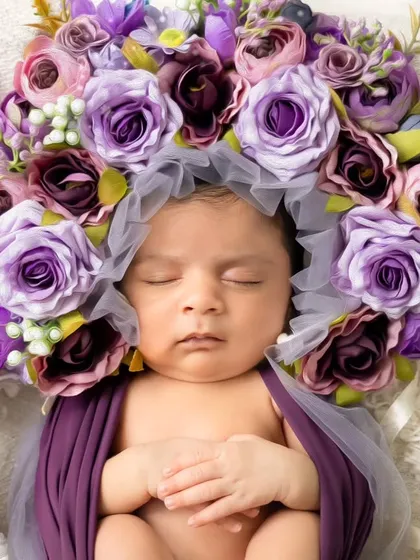 The pure innocence of a newborn. Our fine art newborn sessions are handled with the utmost care in our warm studio, using soft wraps and floral props to create timeless art.