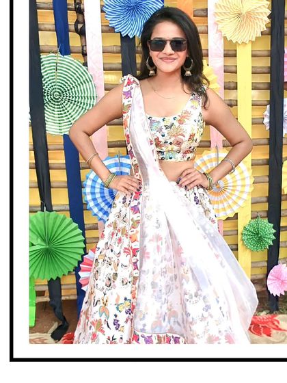 This client is rocking our white floral lehenga with a pair of sunglasses, showing how you can add your own style to our outfits. Perfect for a sunny mehendi function.