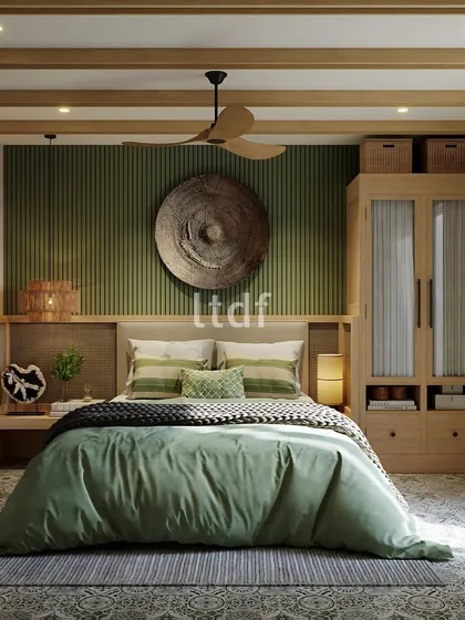 This bedroom design brings out a tropical essence, reflecting swaying palms and serene coastal waters. The green accent wall, natural wood tones, and woven decor create a serene retreat that captures the essence of Goa’s calming, coastal lifestyle.