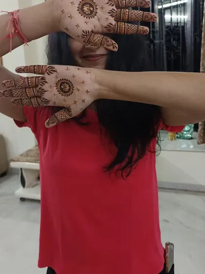 Another happy client with her minimalist mandala design. The small dots around the central pattern add a delicate touch.