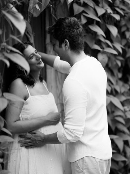 Framed by leaves, this black and white portrait feels intimate and natural. It’s a beautiful capture of the couple in a quiet, shared moment.