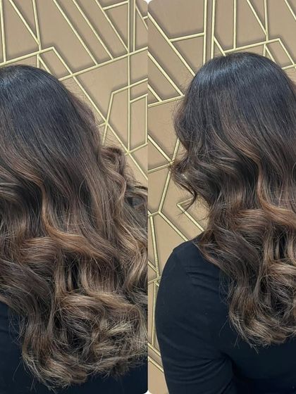 An effortless, sun-kissed look created with our balayage hair treatment. The soft, blended highlights enhance natural beauty.