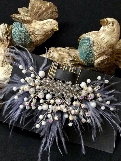 For a more modern and chic look, I love this grey feather comb. The iridescent crystals add a beautiful sparkle.