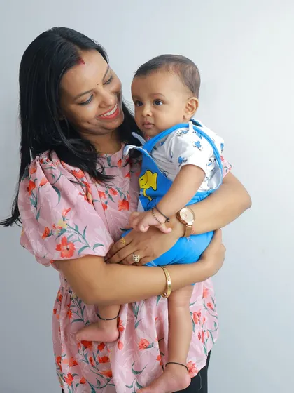 A sweet moment between mother and child. The way she looks at her baby with so much love is what makes this portrait truly special.