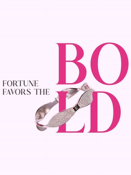 Fortune favors the bold. This twisted, sparkling bangle is a statement of confidence and style.