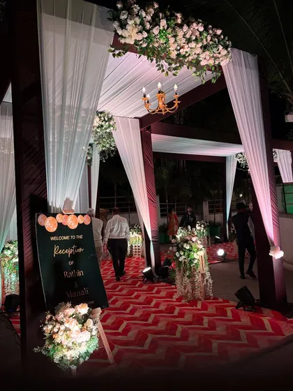 The reception entrance with a personalized welcome sign, inviting guests into the celebration.