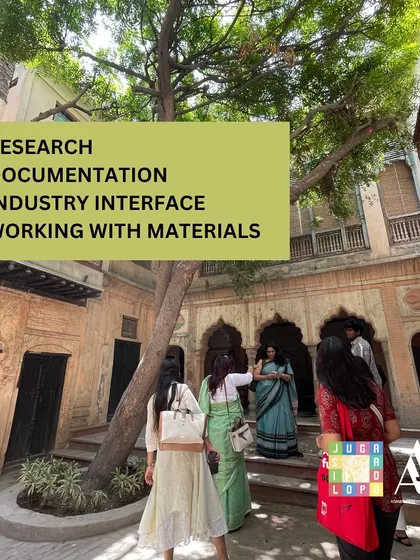 Our summer internship announcement highlights the core activities: research, documentation, industry interface, and working directly with materials. This image captures students on a site visit, fully engaged in the architectural context of a heritage building.
