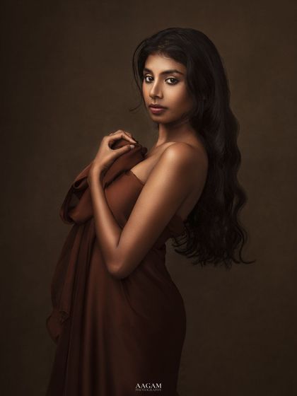 "Everything you can imagine is real." A simple, yet powerful portrait. The way she holds the brown fabric creates a sense of both vulnerability and strength.