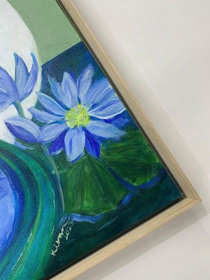 Another angle of the framed painting, highlighting the simple elegance of the wooden floater frame.