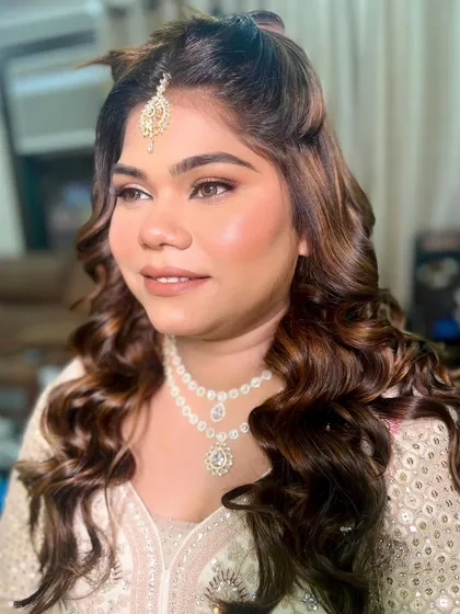 Another angle of the radiant glass skin look for this engagement. The makeup is flawless and luminous from every side.