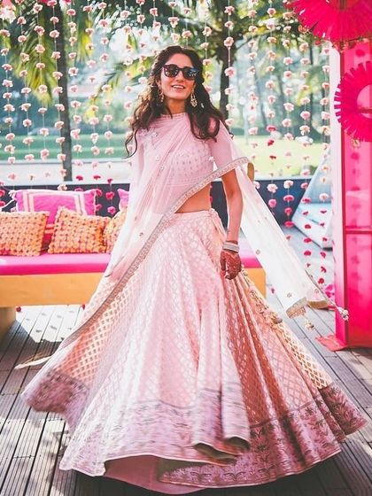 A happy client wearing a light pink lehenga we stitched for a daytime event. We focus on creating outfits that are not only beautiful but also comfortable to wear.