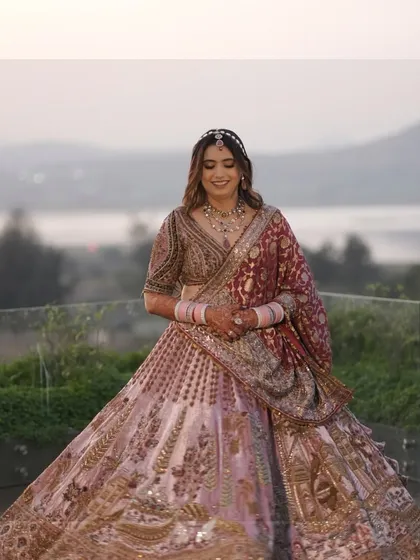 Celebrating the beauty of our incredibly stunning bride against the backdrop of a serene lake at her destination wedding.