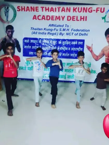 A group of my young students practicing a basic salutation pose. Respect and discipline are the first lessons in my academy.