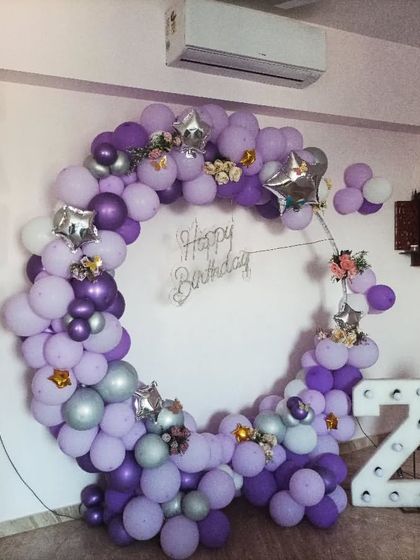 A purple-themed balloon ring for a 24th birthday, complete with marquee numbers and the name in foil letters.