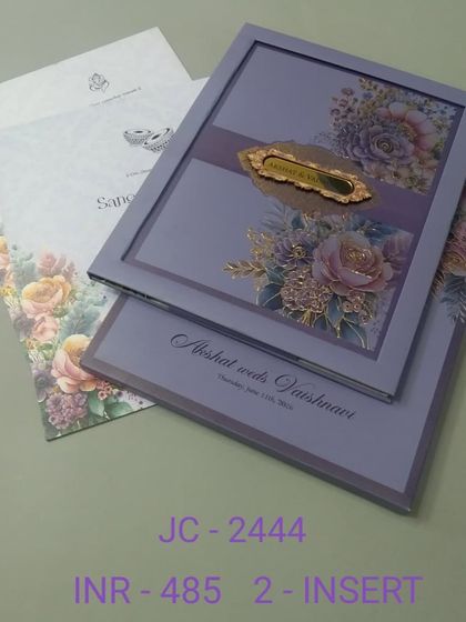 A sophisticated lavender invitation with a framed floral design and a gold nameplate. This two-insert card is perfect for a modern, elegant wedding with a touch of color.