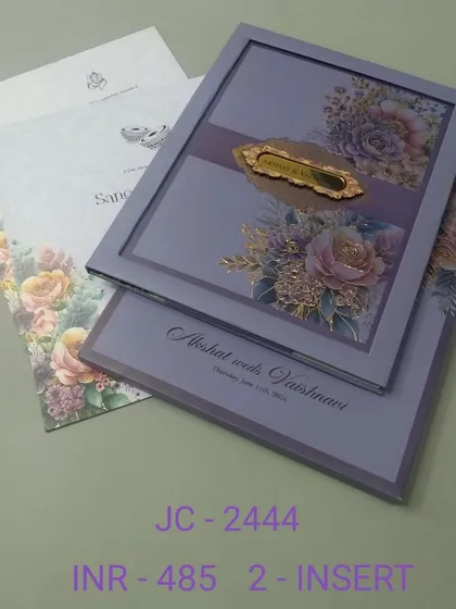A sophisticated lavender invitation with a framed floral design and a gold nameplate. This two-insert card is perfect for a modern, elegant wedding with a touch of color.