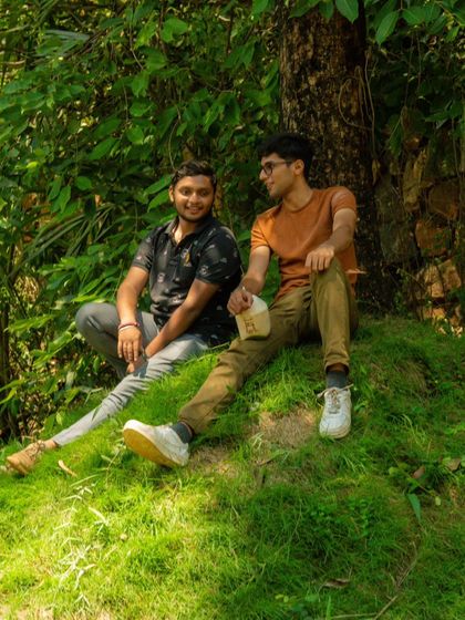 Just two friends chilling in the grass, taking a break between adventures. It's the quiet moments that count too.