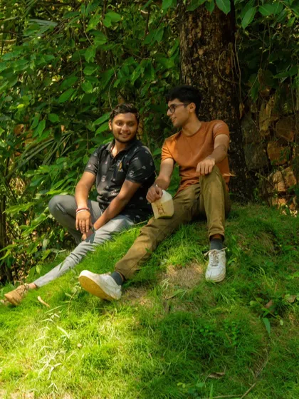 Just two friends chilling in the grass, taking a break between adventures. It's the quiet moments that count too.