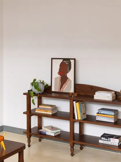 The Chinmayi Open Bookshelf is a charming and playful addition to any room. Its petite size and adorable design make it perfect for displaying your favorite books and decor items.