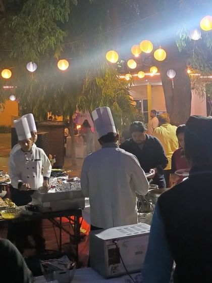 Our chefs interacting with guests at a live food counter. This direct engagement allows for customized orders and adds a personal touch that makes the dining experience more memorable.