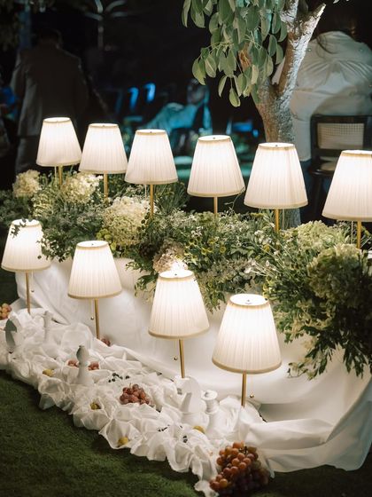 Another view of the table lamps, which add a warm, intimate glow to the outdoor dinner setting.