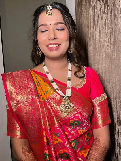 A detailed shot of the eye makeup. The soft, blended colors enhance her eyes beautifully, completing her graceful and timeless bridal look.