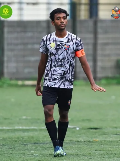 The captain's presence on the field, calm and in control, guiding the team through the match.