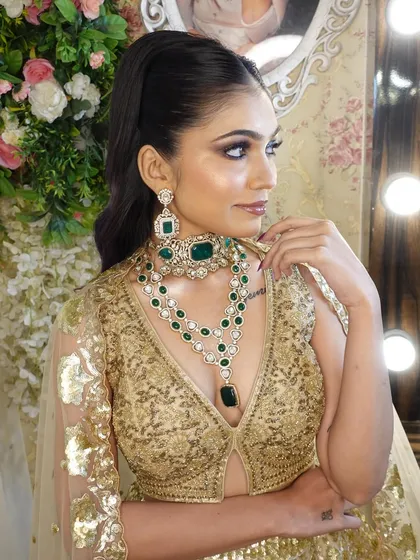 Another angle of the glam look, showing the model's confident pose and the beautiful details of the jewellery.