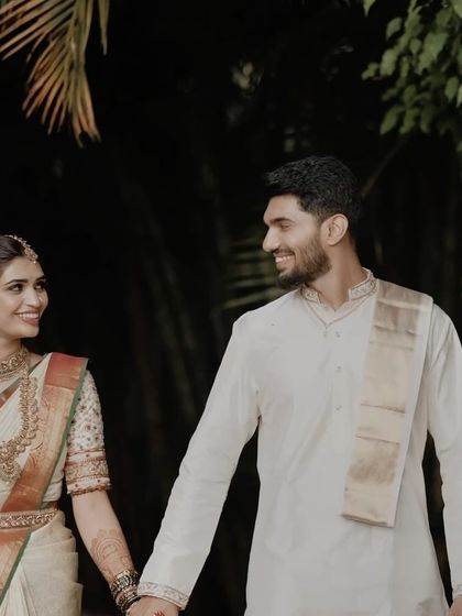 A happy, candid moment of the couple walking together. The genuine smiles and easy connection are what make this traditional pre-wedding portrait special.