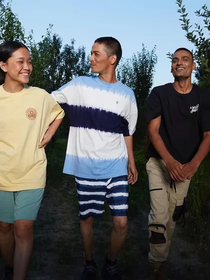 Capturing a moment of genuine connection for a lifestyle brand campaign. Three friends walk together through a sunlit orchard, creating an image that feels authentic, warm, and relatable.