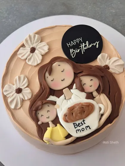A heartwarming cake for the "Best Mom," featuring a handcrafted fondant topper of a mother cuddling her children.
