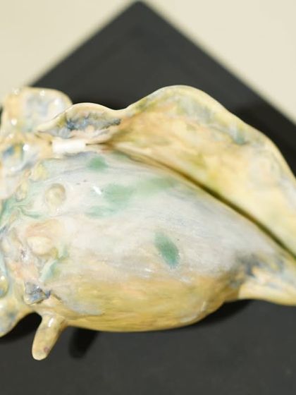 I love finding inspiration in nature, especially marine life. This is a hand-sculpted ceramic conch shell, finished with a soft, watercolour-like glaze.