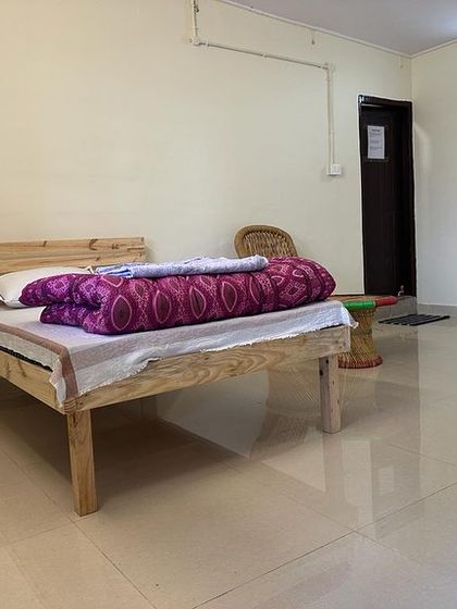 A look inside one of the clean and simple rooms for our students. We provide a comfortable and sattvic environment to support your studies.