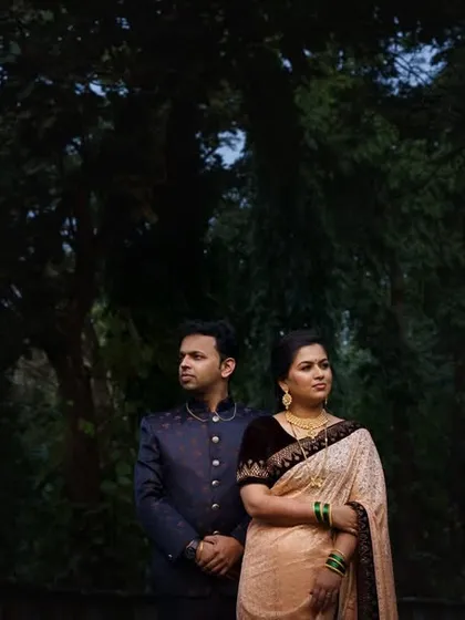 A dramatic and moody portrait of the couple against a backdrop of dark trees. This showcases my ability to use lighting and composition to create artistic and impactful images.
