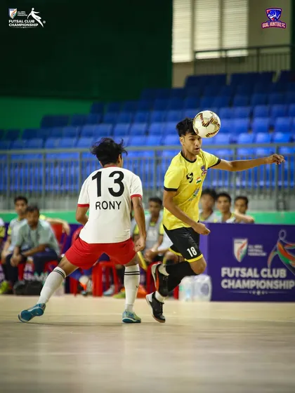 A player controlling the ball with his chest under pressure in the semi-final.